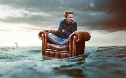 Man on a seat lost at sea